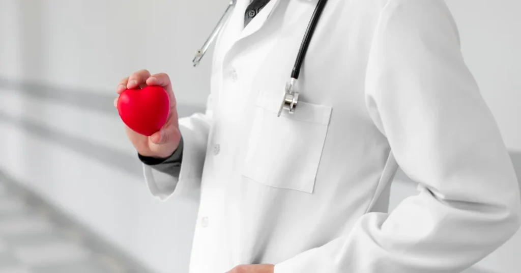 Best cardiologist doctor reviewing cardiac reports with patient at EPIC Hospital Ahmedabad