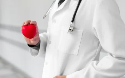 Best cardiologist doctor reviewing cardiac reports with patient at EPIC Hospital Ahmedabad