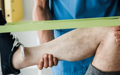 Sports injury specialist assessing an athlete's knee at EPIC Hospital Ahmedabad