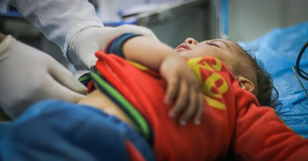 Paediatric cardiac surgeon with young patient at EPIC Hospital Ahmedabad