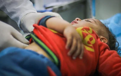 Paediatric cardiac surgeon with young patient at EPIC Hospital Ahmedabad