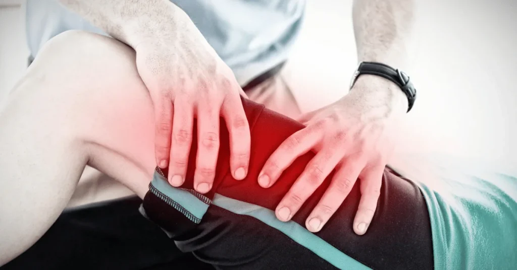 Specialist examining a patient's knee for a ligament tear at EPIC Hospital Ahmedabad