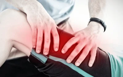 Specialist examining a patient's knee for a ligament tear at EPIC Hospital Ahmedabad
